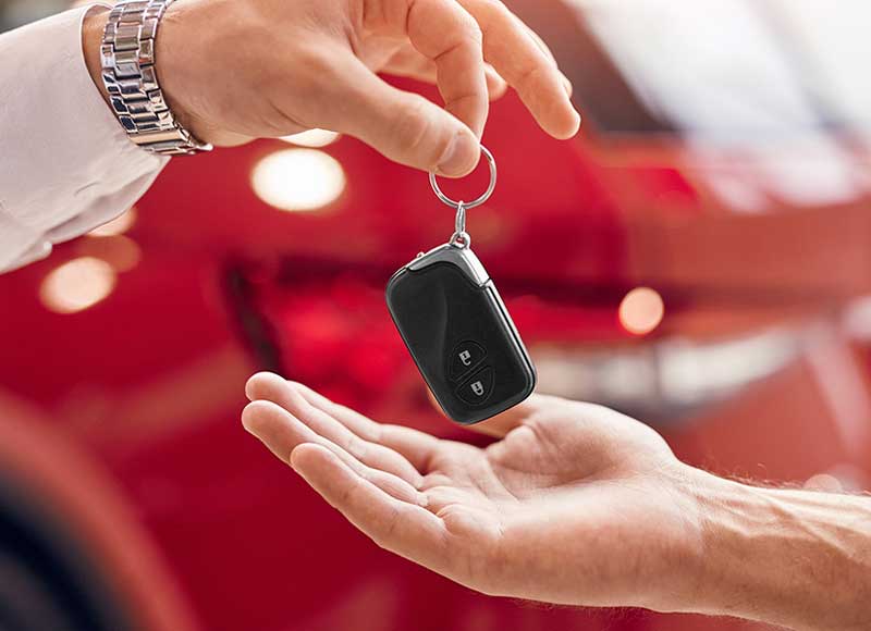 Handing over car keys in dealership